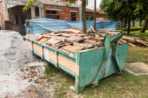 Staff preparing rooms for house clearance in an urban home