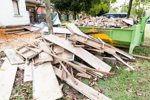 Professional builders waste clearance team at work in Sevensisters